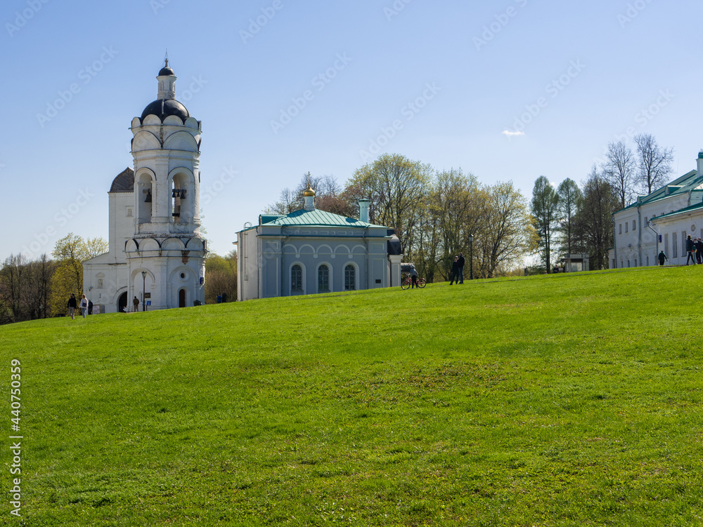 Moscow, Russia - May 1, 2021: Bright sunny spring day in Kolomenskoye park, Moscow. Families walk and ride bicycles in a large park and enjoy the good weather on a may day.