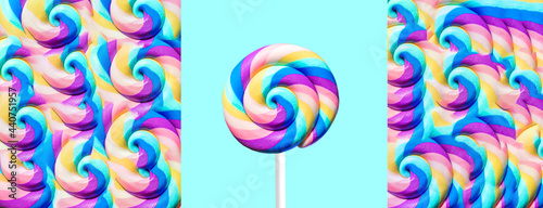 Summer sweet background with colorful lollipop on blue backdrop