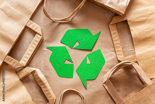 Recycled packaging ,craft packages for packaging goods from online stores, eco friendly packaging made of recyclable raw materials, green arrow recycling symbol