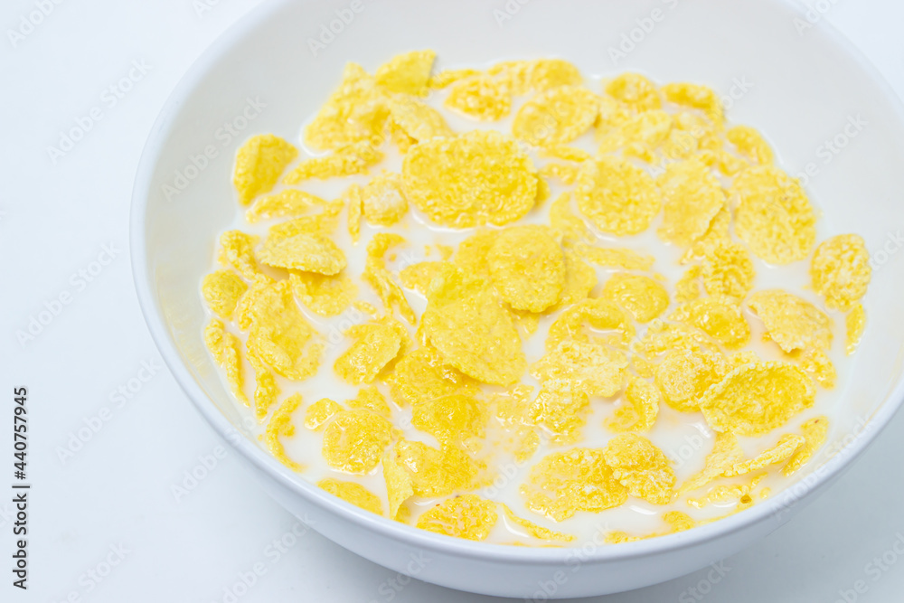 Cornflakes with milk on a white background. Healthy and tasty breakfast. Cornflakes with milk on a white background. Healthy and tasty breakfast.