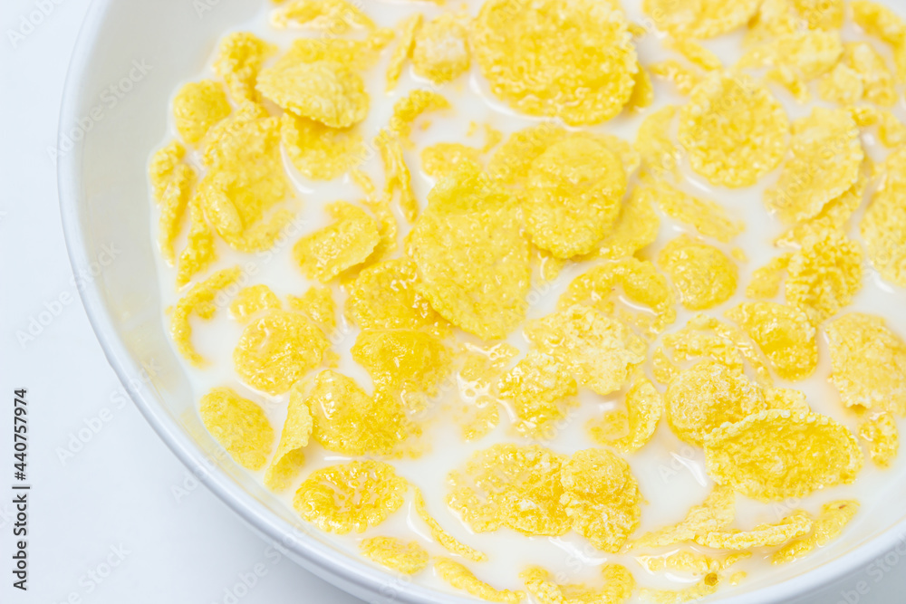 Cornflakes with milk on a white background. Healthy and tasty breakfast. Cornflakes with milk on a white background. Healthy and tasty breakfast.