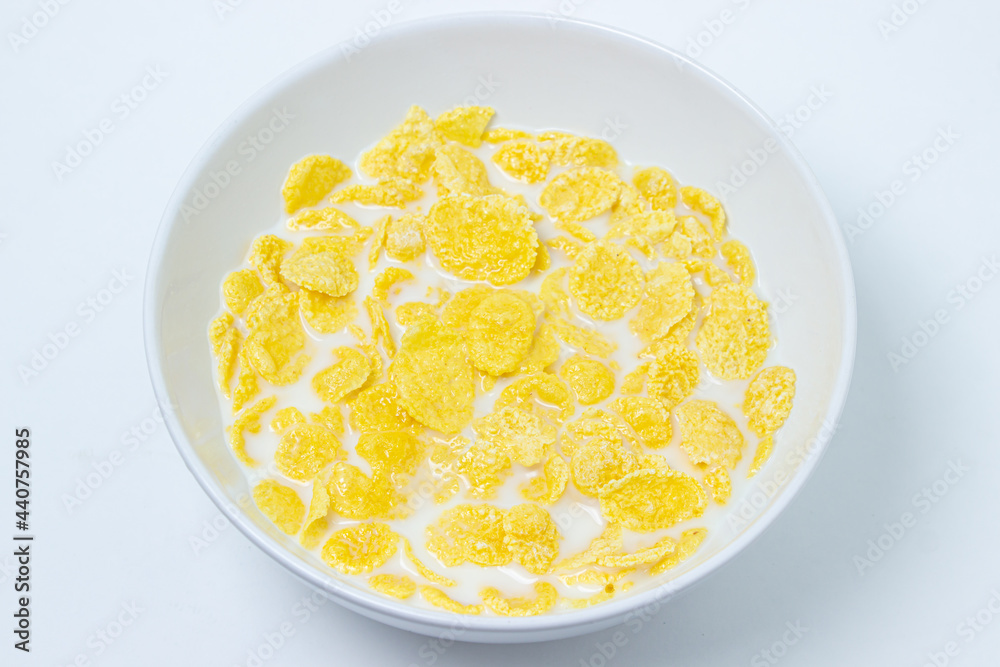 Cornflakes with milk on a white background. Healthy and tasty breakfast. Cornflakes with milk on a white background. Healthy and tasty breakfast.