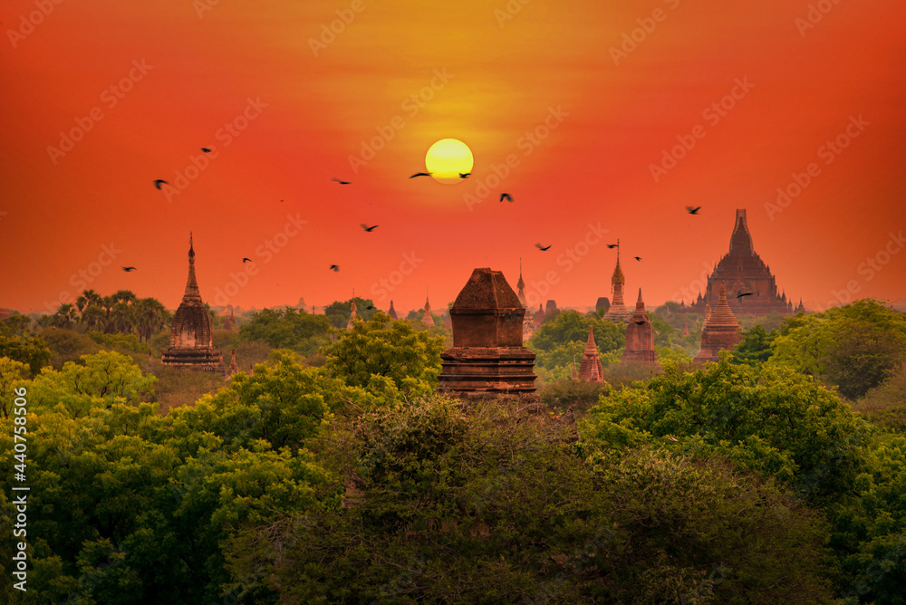 Landscape image of Ancient pagoda at sunset in Bagan, Myanmar.