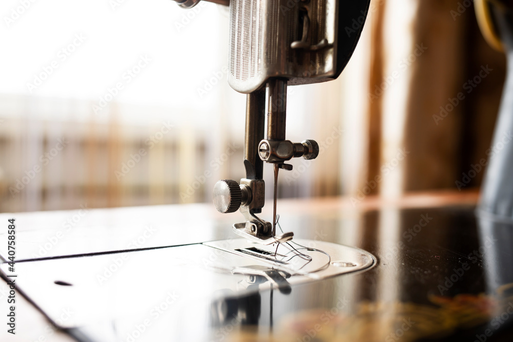 Vintage sewing machine close up in home interior