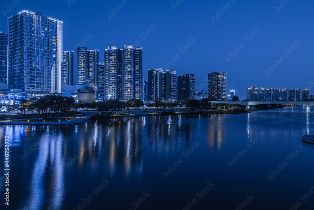 Night view of buildings on the bank of the Jiaomen River in Nansha District, Guangzhou