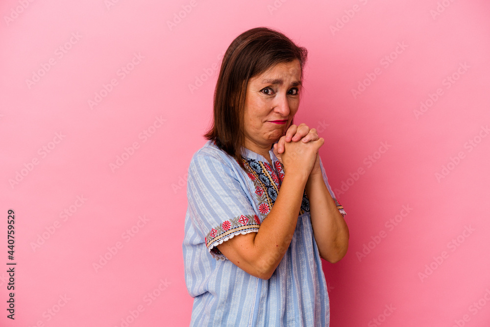Middle age caucasian woman isolated on pink background scared and afraid. Middle age caucasian woman isolated on pink background scared and afraid.