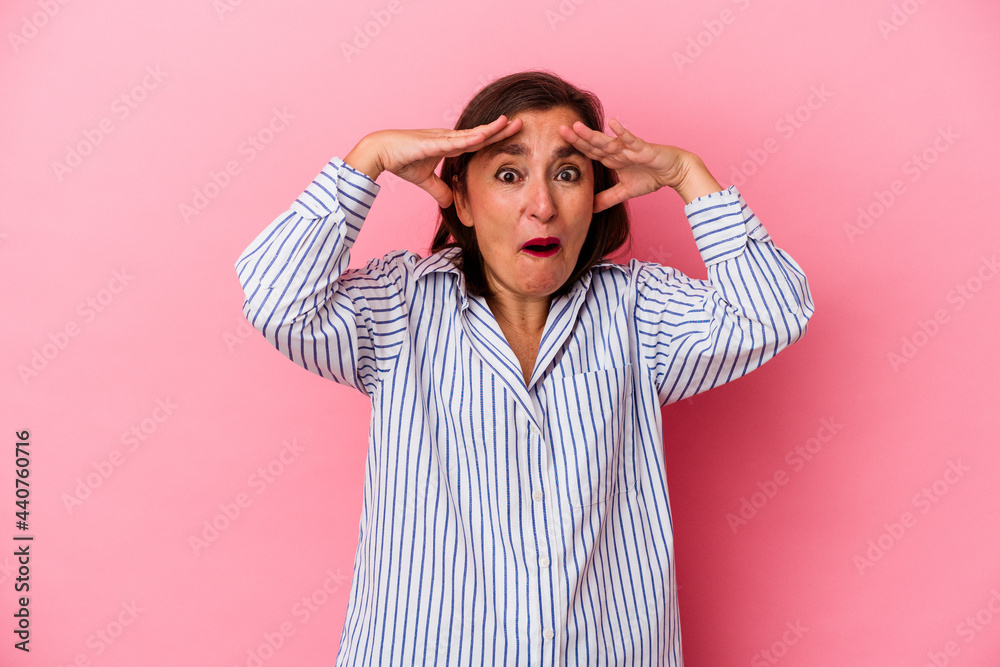 Middle age caucasian woman isolated on pink background celebrating a victory or success, he is surprised and shocked. Middle age caucasian woman isolated on pink background celebrating a victory or success, he is surprised and shocked.