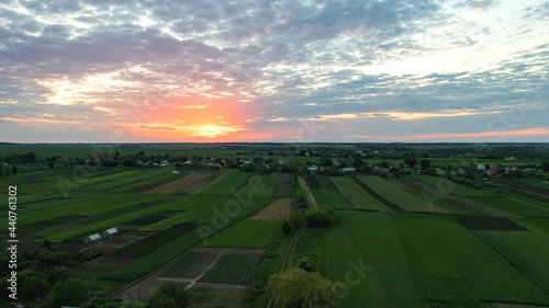 Aerial view landscape with spacious European landscape with farm and land at sunset of summer day