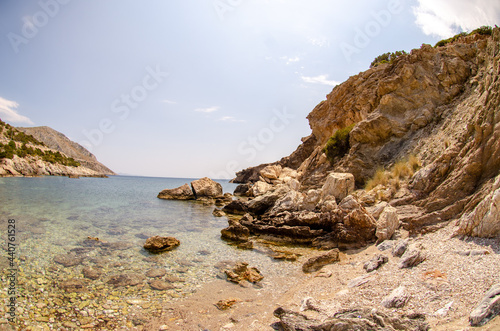 Beautiful scenery of rocky beach in Anavyssos, Greece on a fine day photo