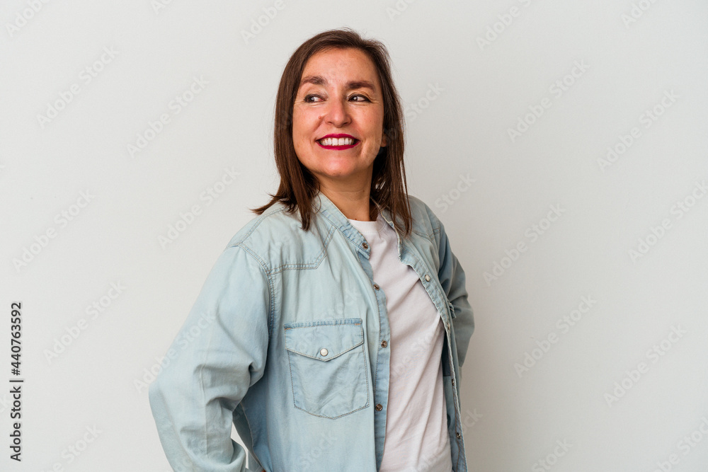 Middle age caucasian woman isolated on white background laughs happily and has fun keeping hands on stomach. Middle age caucasian woman isolated on white background laughs happily and has fun keeping hands on stomach.