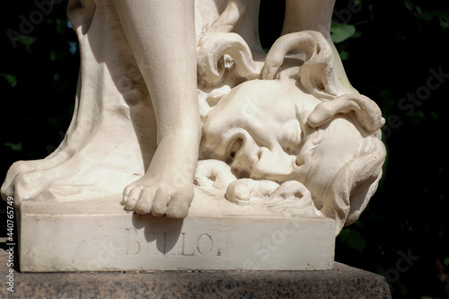 Head of Medusa Gorgon and leg of goddess Bellona, anticue statue in Summer garden, Saint-Petersburg, Russia