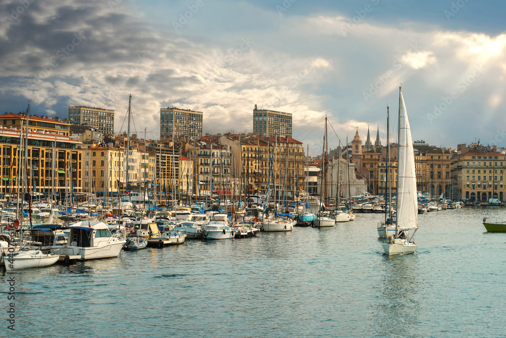 Cityscape with yachts and boats in harbour of Marseille. France