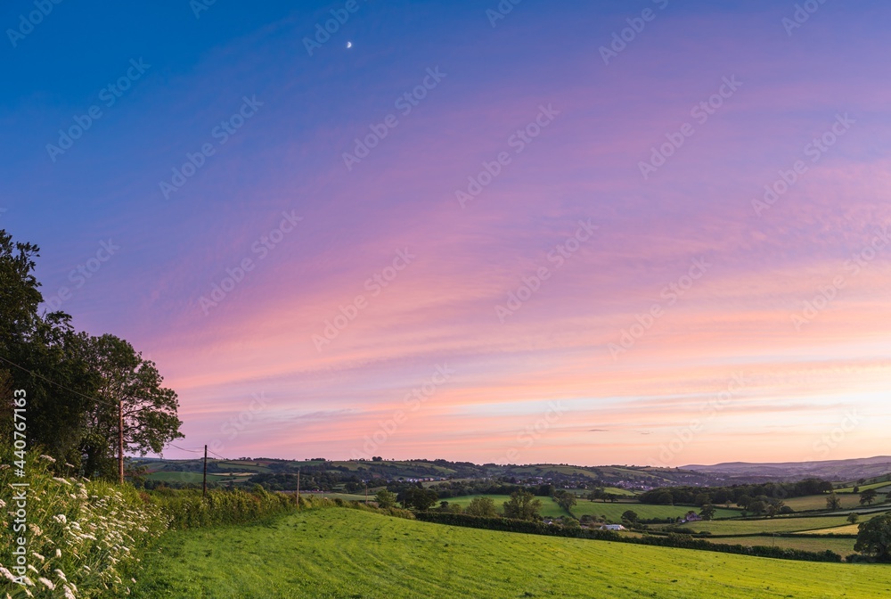 Sunset over fields in Berry Pomeroy Village, Devon, England, Europe