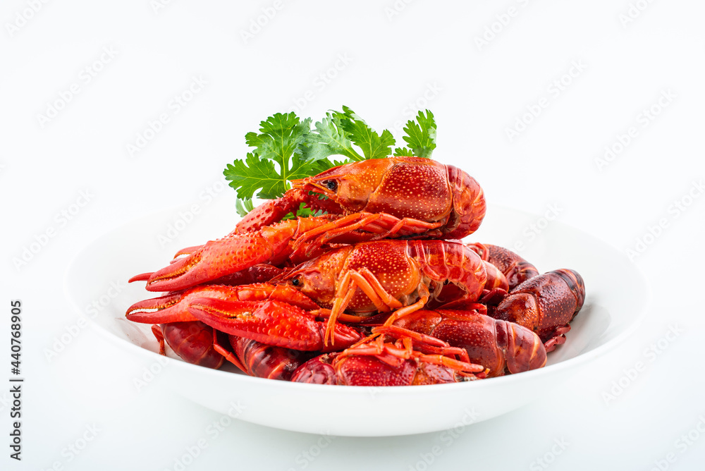 Delicious crayfish on a plate on white background Delicious crayfish on a plate on white background