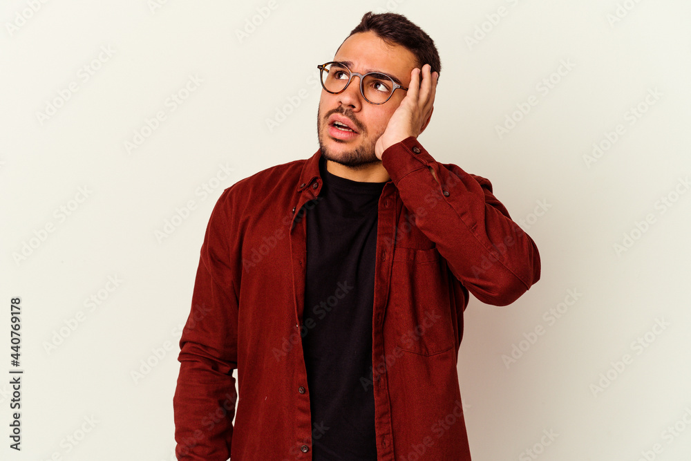 Fototapeta premium Young caucasian man isolated on white background being shocked, she has remembered important meeting.