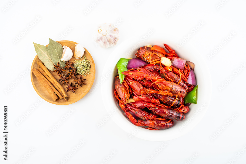 Spicy crayfish in a pot on white background Spicy crayfish in a pot on white background