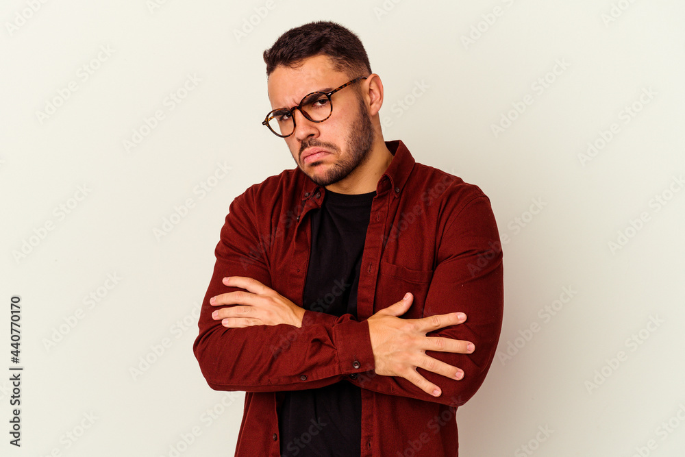 Fototapeta premium Young caucasian man isolated on white background tired of a repetitive task.