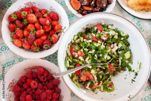 Homemade salad of fresh vegetables and fresh ripe berries