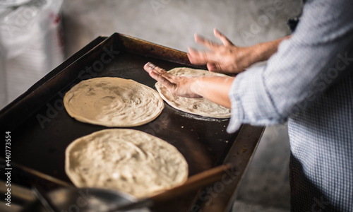 Kneaded dough for making roti in a breakfast restaurant in Narathiwat, Thailand.
