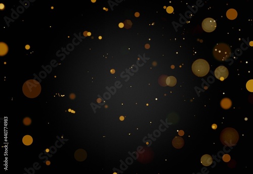 Glittering gold stars of bokeh use for celebrating on a dark background