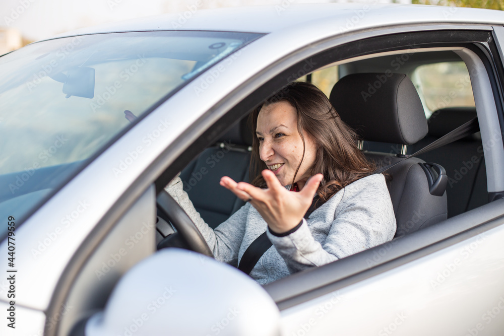 Nervous woman in car traffic