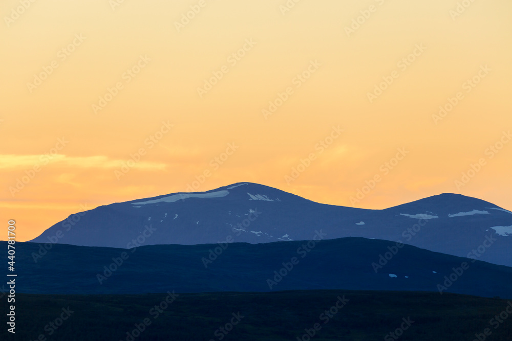 Mountain silhouettes at sunset