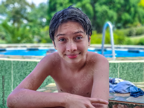 Boy bathing in pool photo