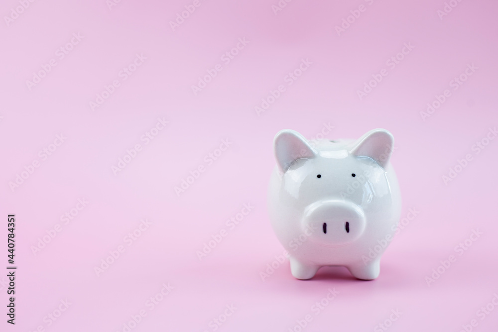 Piggy bank on pastel pink background, Business finance saving piggy bank concept, Copy space.