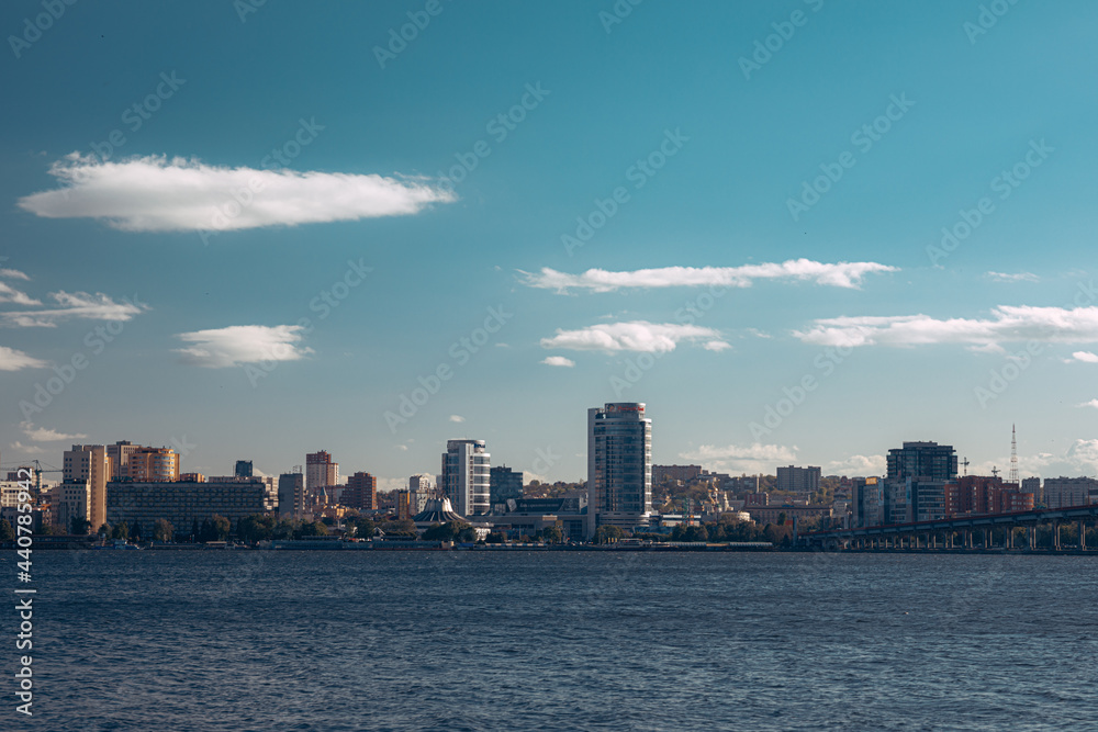 A large body of water with a city in the background