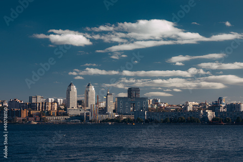 A large body of water with a city in the background © Ванжа Юрий