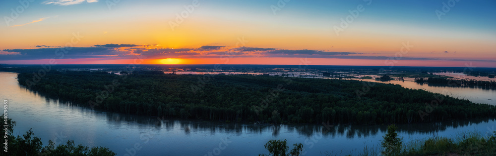 Big panoramic picture view of river landscape in sunny summer evening