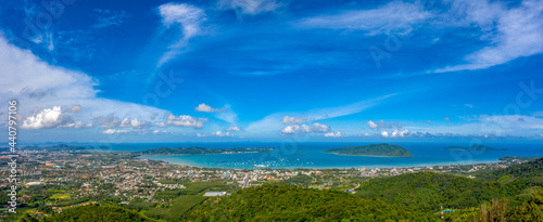 aerial panorama view Chalong gulf in blue sea. Loan island is close to Chalong pier..Houses, buildings of Phuket Town.