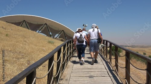 Gobeklitepe, Sanliurfa, Turkey - 15th of June 2021: 4K Tourists approaches Gobekli Tepe archaeological site
 photo