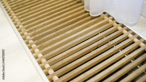 A white curtain flies in the wind. Ventilation and floor heating near the balcony. Insulation in the floor.