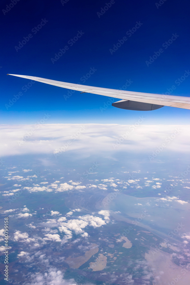 Wing of an airplane in the sky.