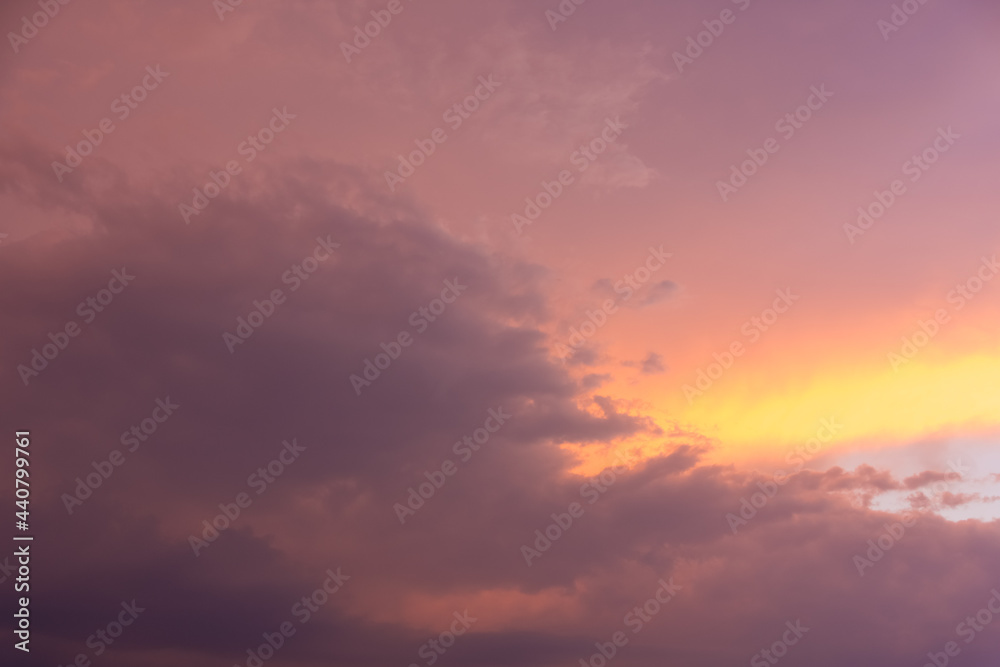Cloudy stormy sunset with fiery orange glow