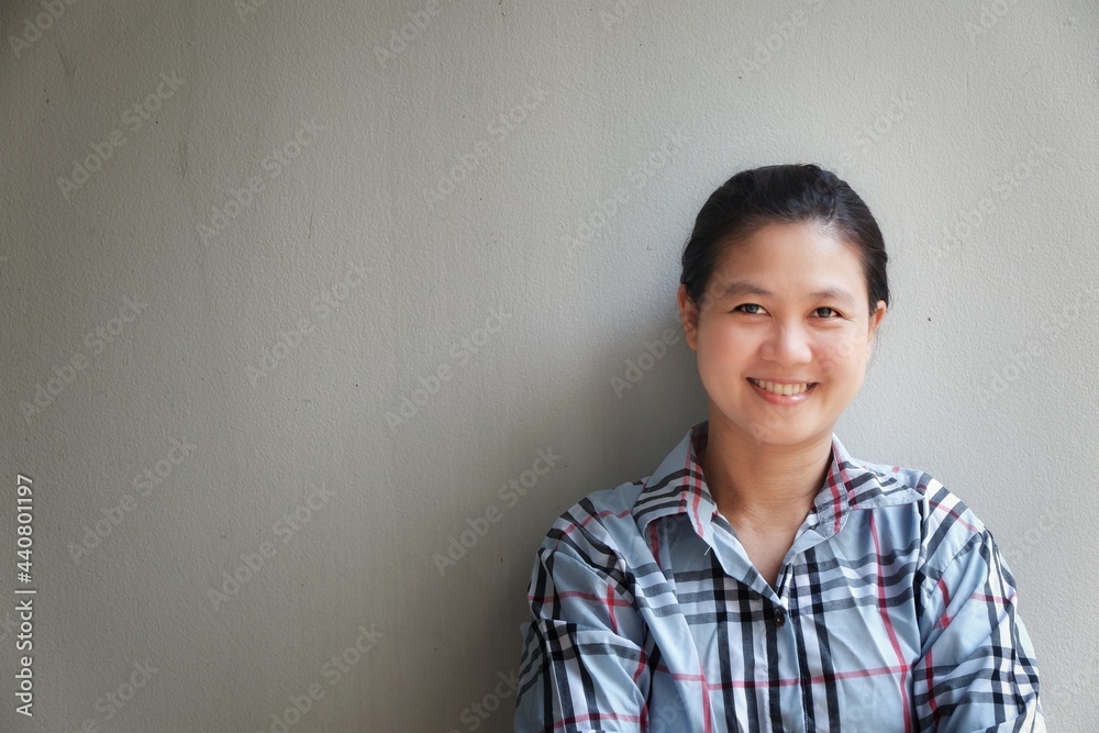 portrait of a Beautiful Woman smiling on Grey Background portrait of a Beautiful Woman smiling on Grey Background