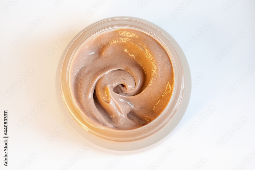Cream in a jar on a white background Cream in a jar on a white background