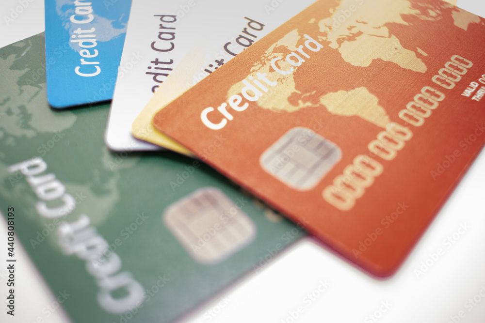 different color chipped credit card lying on white bacground different color chipped credit card lying on white bacground