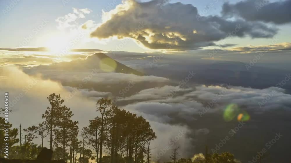 Landscape panorama view of Volcan de Fuego in Guatemala during eruption with smoke and dust in the air. Active stratovolcano of Acatenango constantly active spewing lava, rock and ash.