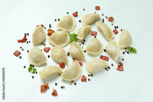 Concept of tasty food with vareniki or pierogi on white background