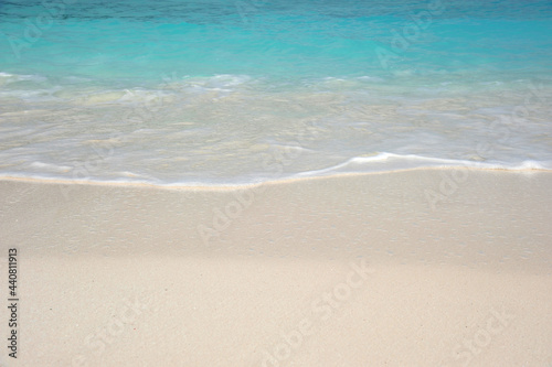 white sand beach with sea water