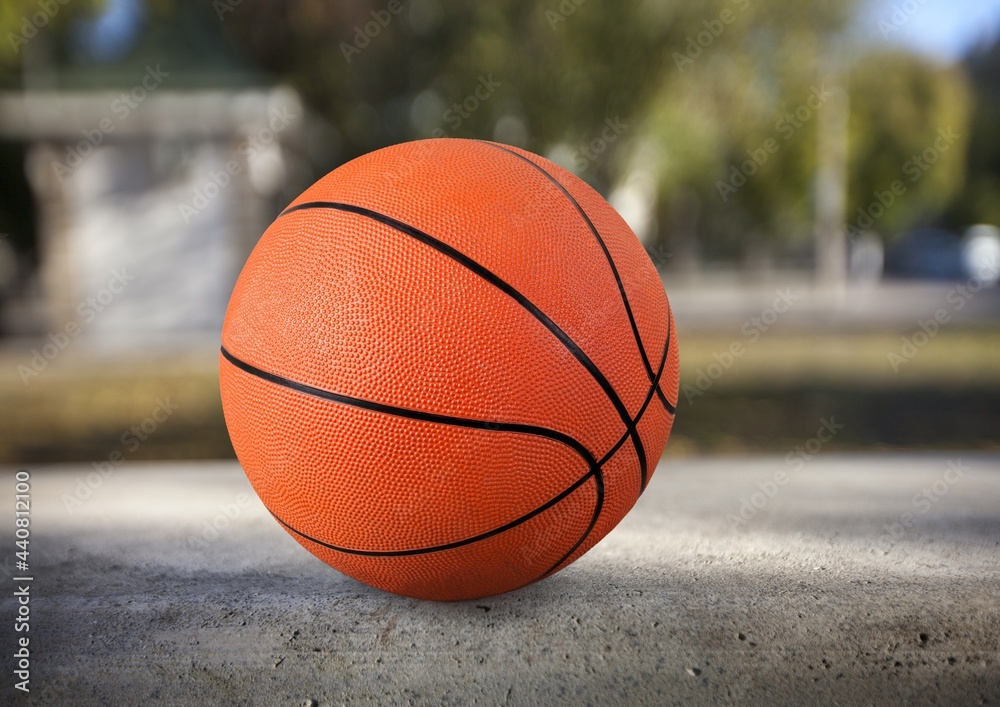 New orange basketball ball on the floor New orange basketball ball on the floor
