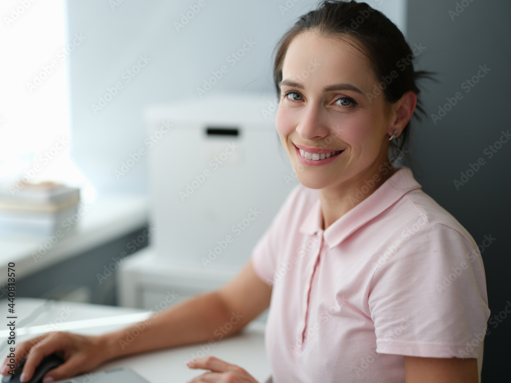 Young brunette woman sitting at table at home portrait Young brunette woman sitting at table at home portrait