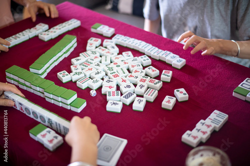 People playing mahjong traditional Chinese board game