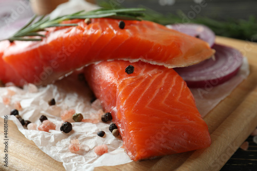 Fresh raw salmon and ingredients for cooking, close up