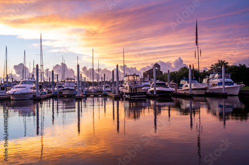 Fresh beautiful Sunday morning sunrise at a marina full of boats on the seaside near the ocean great lifestyle or travel destination © Fred Facker