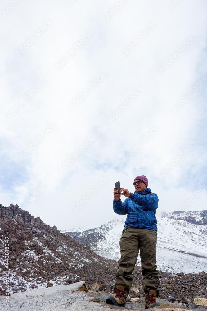 A hiker taking a selfie during on the Pico de Orizaba