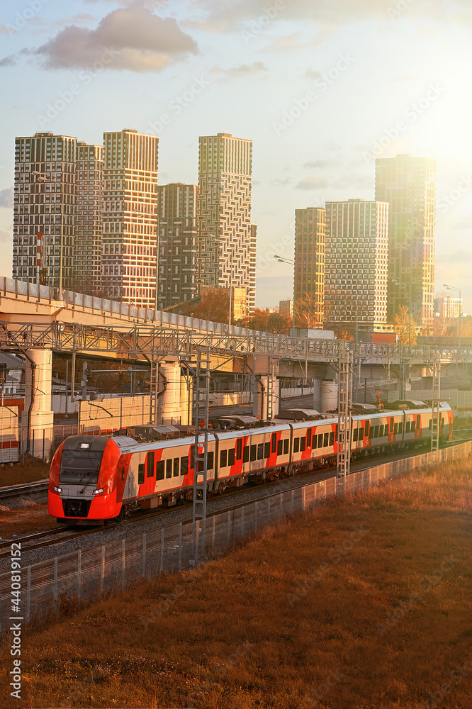 Obraz premium Passenger transportation on the background of modern buildings and road overpasses