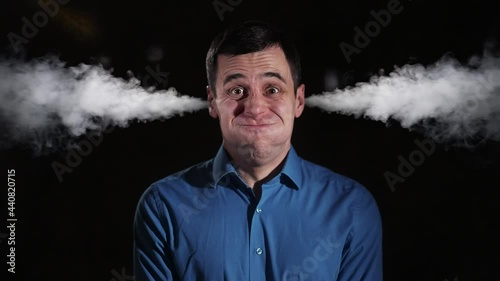 Man letting off steam from his ears